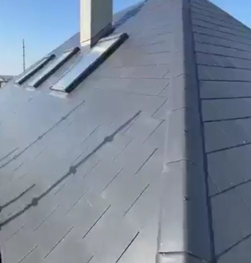 Roof windows flashed into a slate roof by AH Roofing